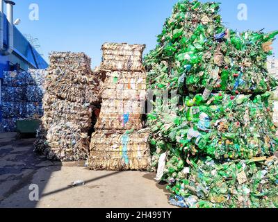 Recycled used plastic bottles in bales at a recycling facility Stock Photo