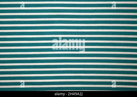 Fabric green cotton striped top view. Cotton and polyester fabric texture. Close-up textiles. Stock Photo