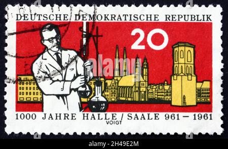 GERMANY - CIRCA 1961: a stamp printed in Germany shows chemist and five towers of Halle, 1000th anniversary of the founding of Halle, the largest city Stock Photo