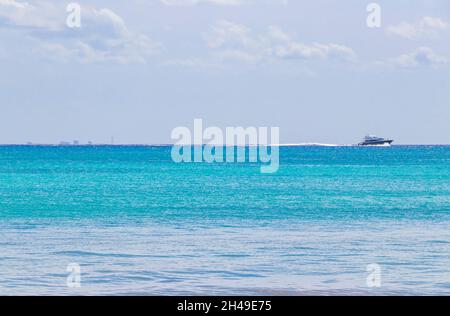 Boats and yachts between Cozumel island and the tropical mexican beach panorama view from Playa 88 and Punta Esmeralda in Playa del Carmen Mexico. Stock Photo