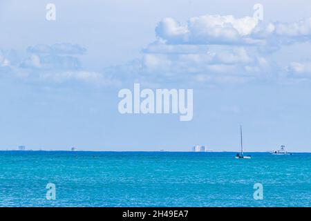 Boats and yachts between Cozumel island and the tropical mexican beach panorama view from Playa 88 and Punta Esmeralda in Playa del Carmen Mexico. Stock Photo