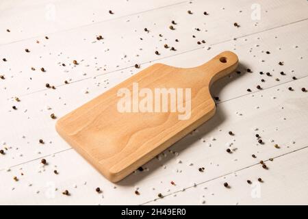 wooden cutting board on wooden table Stock Photo