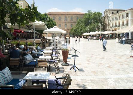 Naflio - Greece - May 25 2018 : Tourists and holiday makers at pavement cafes in elegant constitution square  Landscape aspect shot Stock Photo