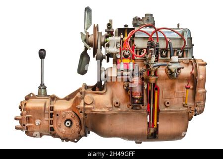 Side view of a disassembled vintage car engine with transmission and gear shift isolated on a white background Stock Photo