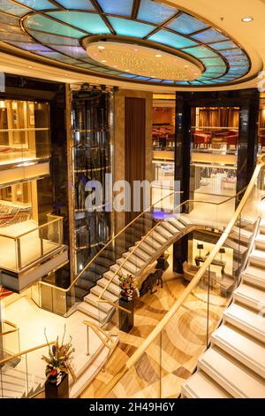 Southampton, UK - 30th September 2021: The luxury P and O cruise ship Ventura. Interior shot of the glass atrium and stairwyays in the centre or the s Stock Photo