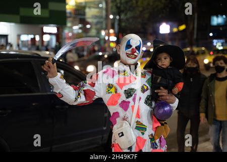 Bogota, Colombia, October 31, 2021. People walk out into town in disguise to celebrate Halloween. Stock Photo