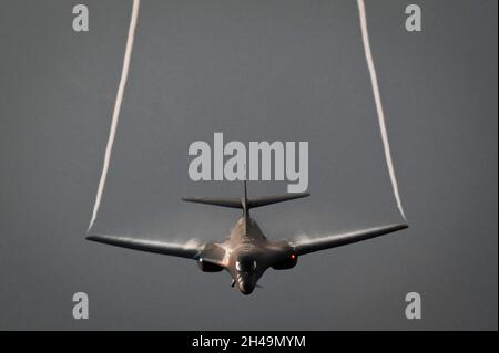Persian Gulf, Bahrain. 30 October, 2021. A U.S. Air Force B1-B Lancer strategic bomber generates wingtip vortices as it climbs during a presence patrol over the Persian Gulf October 30, 2021 near Bahrain. Credit: SrA Jerreht Harris/Planetpix/Alamy Live News