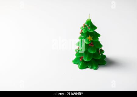 Christmas tree green decorative candle isolated on white background Stock Photo