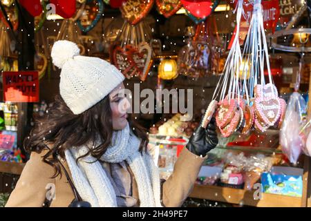 Symbol image: Attractive young woman at a german christmas market (Model released) Stock Photo