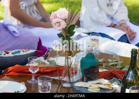 picnic in park babyshower with wine and lantern Stock Photo