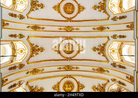 Symmetric view of the golden decorations on the ceiling which are part of the interior architecture of the Church of Nossa Senhora do Monte do Carmo d Stock Photo