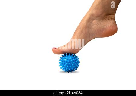 Woman with a blue spiky massage ball under her foot Stock Photo - Alamy