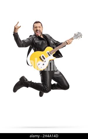 Male rock musician with an electric guitar jumping isolated on white background Stock Photo