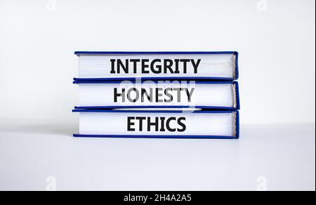 Integrity honesty ethics symbol. Concept words 'Integrity honesty ethics' on books. Beautiful white background. Business and Integrity honesty ethics Stock Photo