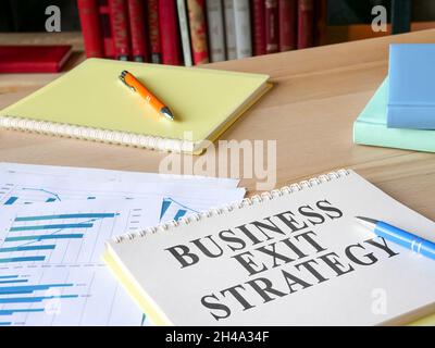 Business exit strategy papers on the desk. Stock Photo