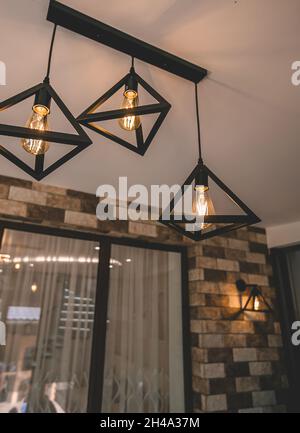 Chandelier pendant black metal triangle 1 lamp vintage and retro style Stock Photo