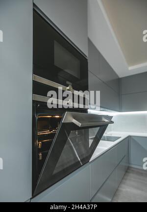Modern furniture in the kitchen oven and microwave are built into the furniture Stock Photo