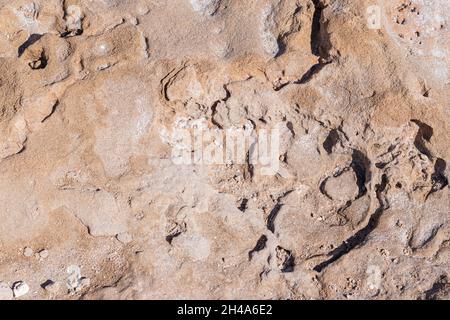 textured background brown stone with cracks on the surface. copy space. abstract stone background for design. Stock Photo