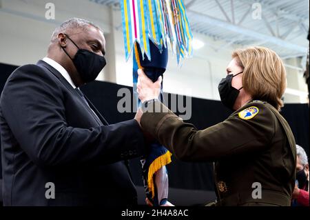 Doral, United States of America. 29 October, 2021. U.S. Secretary of Defense Lloyd Austin passes the Southern Command guidon to the incoming commander Army Gen. Laura J. Richardson during the change of command ceremony, October 29, 2021 in Doral, Florida. Credit: Lisa Ferdinando/DOD/Alamy Live News Stock Photo