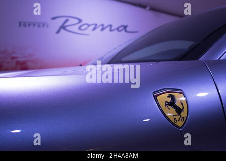 Modena, Italy - July 14, 2021: Prancing horse Yellow Logo on the Ferrari Roma type F169  model Gray front wing high-performance Italian sports car in Stock Photo