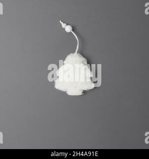 Fluffy white fur tree on a gray background. View from above Stock Photo