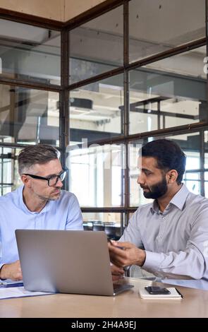 Businessmen that work together in office. Concept of teamwork and ...
