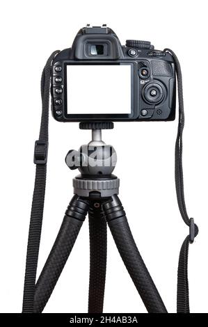 Modern DSLR camera on tripod isolated on white background Stock Photo