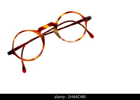Round retro tortoiseshell glasses isolated on white background, clipping path, copy space Stock Photo