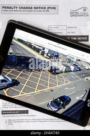 A Penalty Charge Notice for stopping in a box junction with camera evidence on ipad.  NB data anonymised. Stock Photo