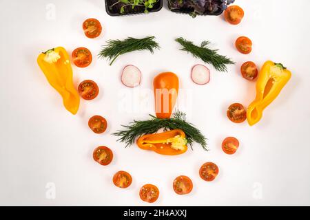 A person's face made of vegetables on a white background. Stock Photo