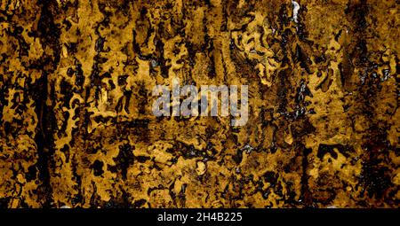 Abstract old crumpled ruberoid texture. Dark background with resin surface Stock Photo