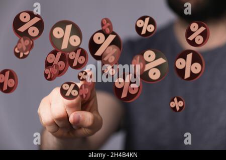 Person presenting the virtual projection of percent signs - sale or discount concept Stock Photo