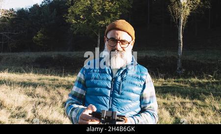 portrait of a man operating the remote control of a drone. Stock Photo