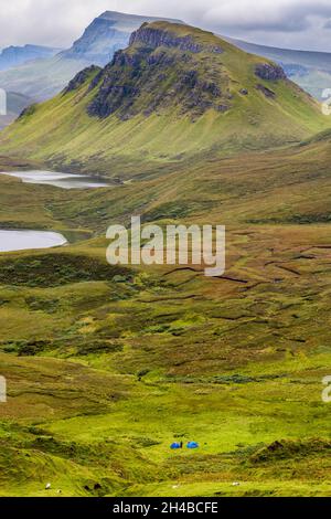 Tents and wild camping on dramatic mountain scenery on the Isle of Skye, Scotland. Stock Photo
