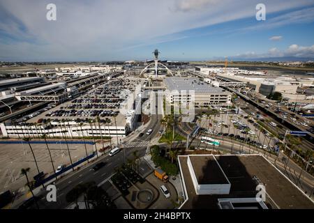 Los Angeles, California, USA. 28th Mar, 2019. The Los Angeles International Airport (LAX) central terminal area (CTA), Theme Building, and Air Traffic Control Tower (ATC) as seen from the roof of the Clifton A. Moore Administration Building, the former air traffic control tower, on Thursday, March 28, 2019 in Los Angeles, Calif. © 2019 Patrick T. Fallon (Credit Image: © Patrick Fallon/ZUMA Press Wire) Stock Photo