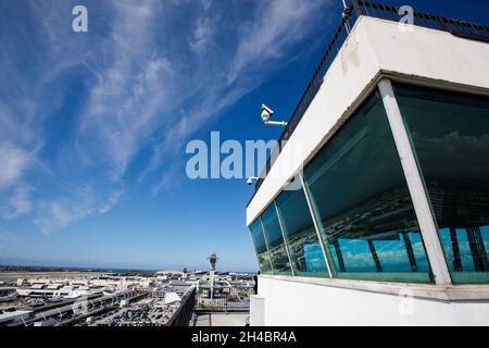 Los Angeles, California, USA. 28th Mar, 2019. The former air traffic control tower atop the Clifton A. Moore Administration Building at Los Angeles International Airport (LAX) overlooking the central terminal area (CTA) including the new ATC tower and Theme Building on Thursday, March 28, 2019 in Los Angeles, Calif. © 2019 Patrick T. Fallon (Credit Image: © Patrick Fallon/ZUMA Press Wire) Stock Photo