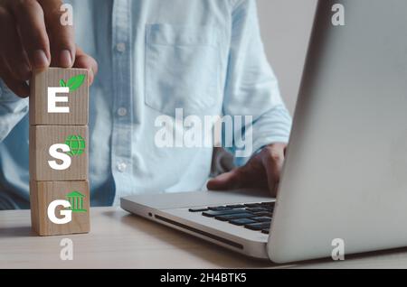 Wooden cube  with symbol of esg concept. ESG (Environment, Social, Governance) investment concept that focuses on the environment, society and good go Stock Photo