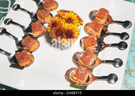 An hors d'oeuvre, appetizers are being passed at an event. Stock Photo