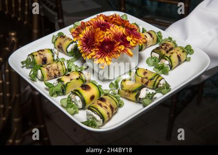 An hors d'oeuvre, appetizers are being passed at an event. Stock Photo