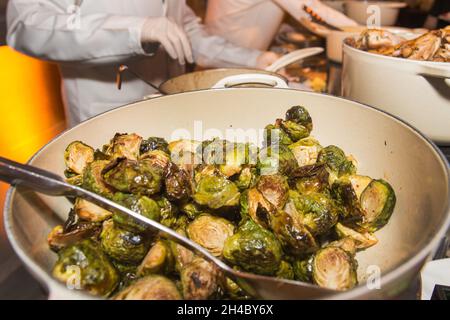 Brussels sprouts are served at a dinner buffet at an event. Stock Photo