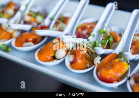 An hors d'oeuvre, appetizers are being passed at an event. Stock Photo