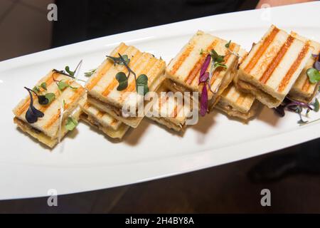 An hors d'oeuvre, appetizers are being passed at an event. Stock Photo