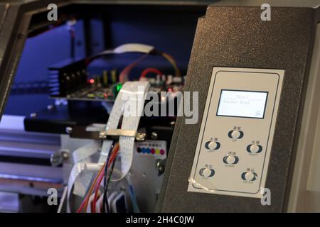 Control panel and circuit board of large format printer. Selective focus. Stock Photo