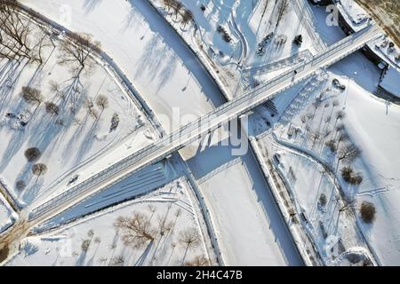 Top view of the pedestrian bridge over the frozen Svisloch river in Minsk. Belarus. Stock Photo