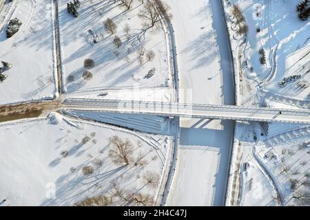 Top view of the pedestrian bridge over the frozen Svisloch river in Minsk. Belarus. Stock Photo