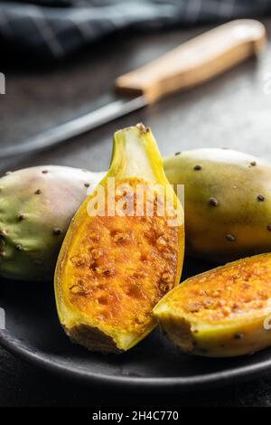 Raw prickly pears. Opuntia or indian fig cactus on plate. Stock Photo