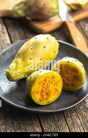 Raw prickly pears. Opuntia or indian fig cactus on plate. Stock Photo