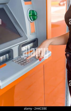 Enter the secret number at an ATM Stock Photo - Alamy