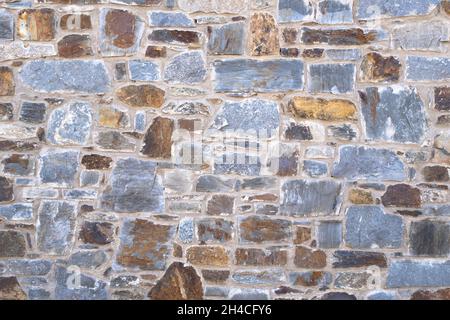 Stonewall texture. Natural stone brick. Stock Photo