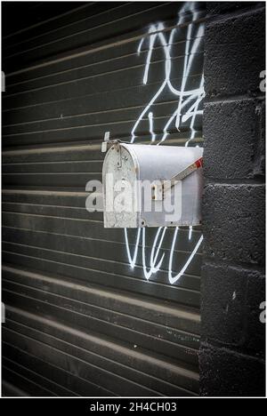 Vertical shot of a mailbox on a street Stock Photo